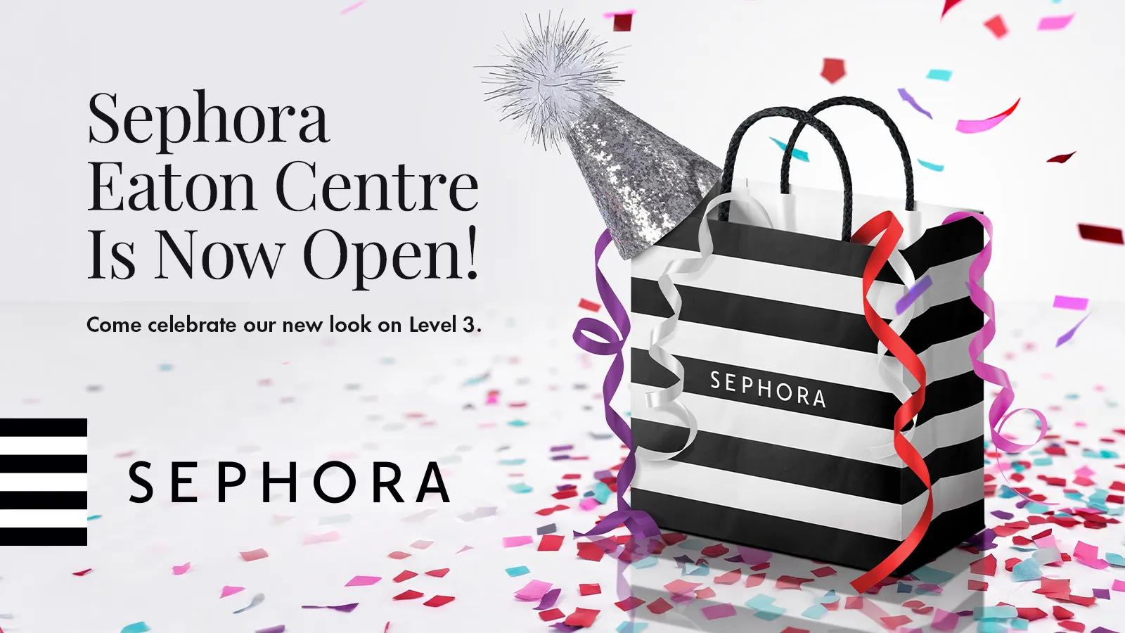 A Sephora promotional banner with a striped shopping bag, party hat, and confetti announcing the opening of Sephora Eaton Centre on Level 3.